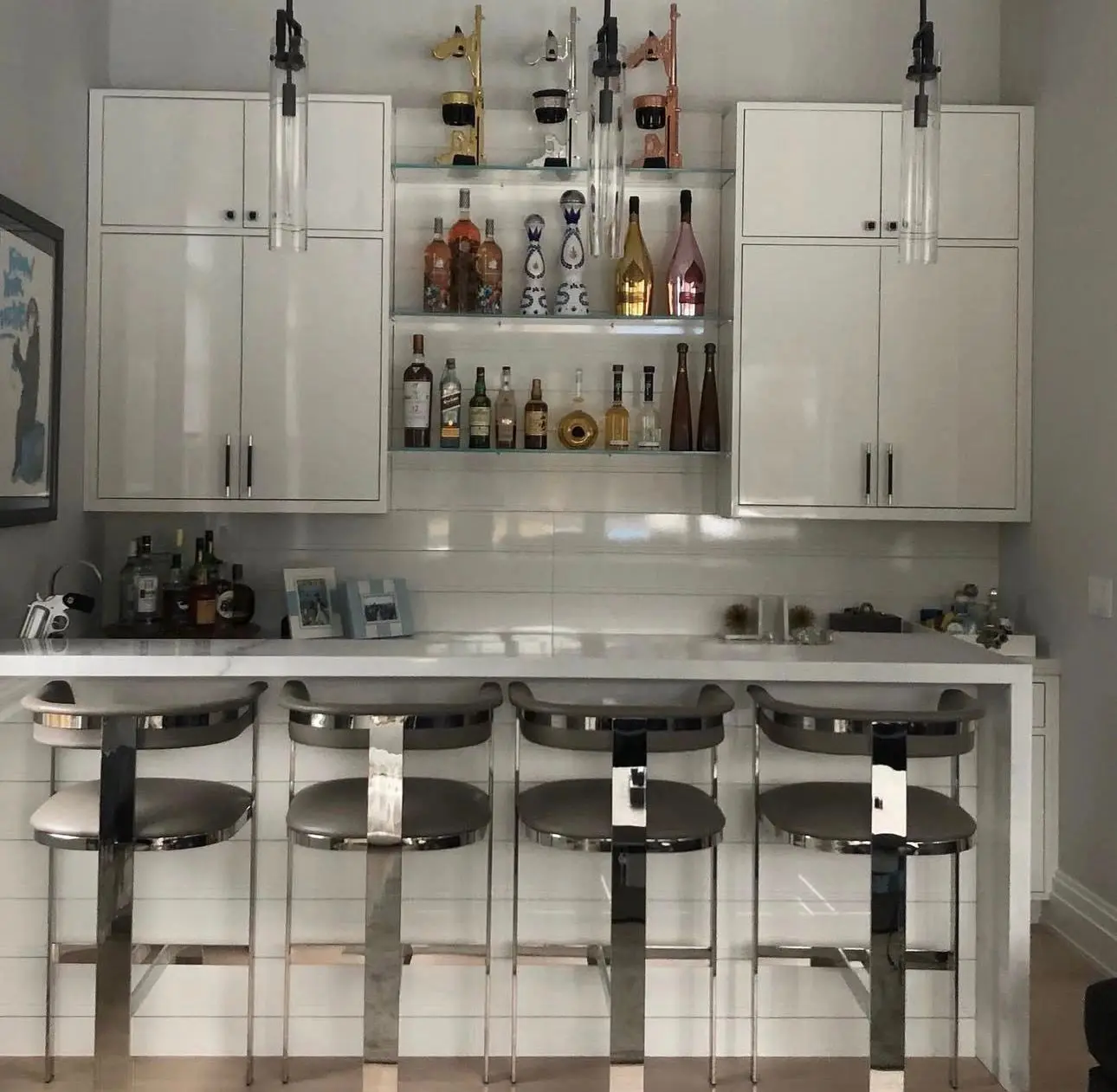 White bar cabinetry with open display shelves